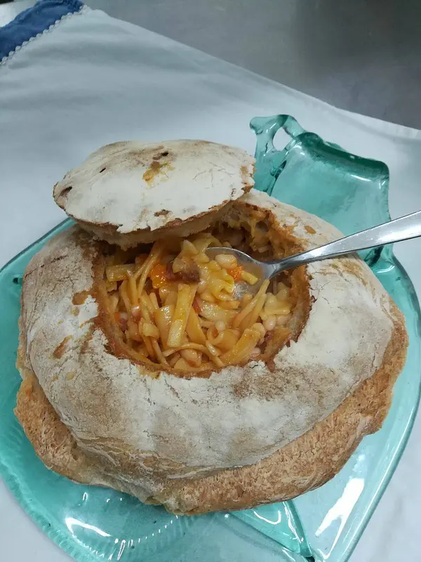 Pasta and beans in a loaf of bread